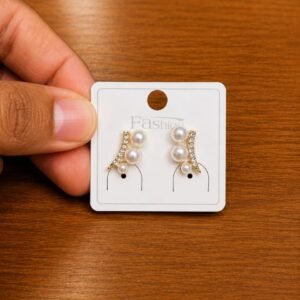 Pearl Leaf Climber Earrings in gold-tone style with curved leaf-like rows with small pearl-like accents