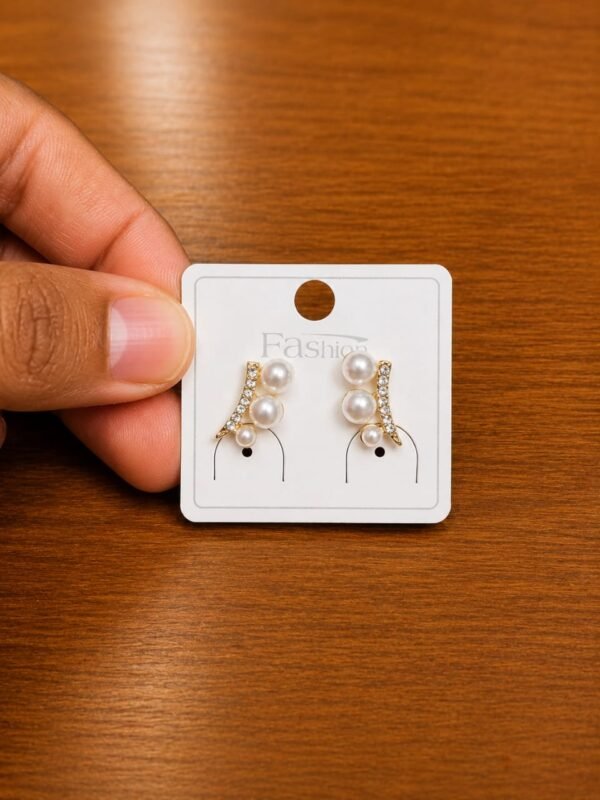 Pearl Leaf Climber Earrings in gold-tone style with curved leaf-like rows with small pearl-like accents