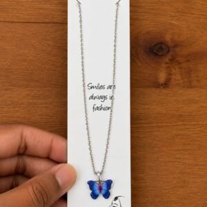 Silver-tone necklace with a blue and purple butterfly pendant