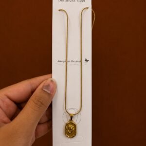 Gold-tone tulip necklace with an embossed oval medallion