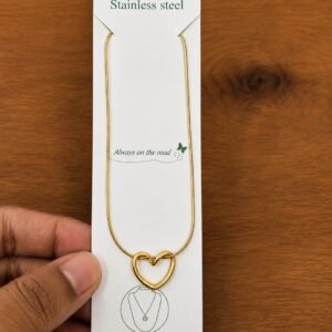 Gold-tone heart knot necklace with an open outline design